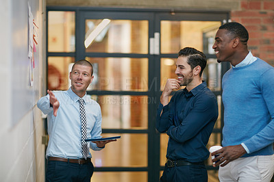 Buy stock photo Cropped shot of three businessmen in the office