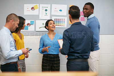 Buy stock photo Cropped shot of a group of businesspeople talking in the office