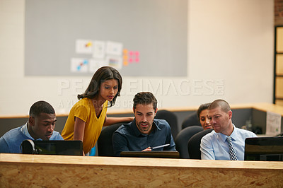 Buy stock photo Cropped shot of a group of creative professionals working in the office
