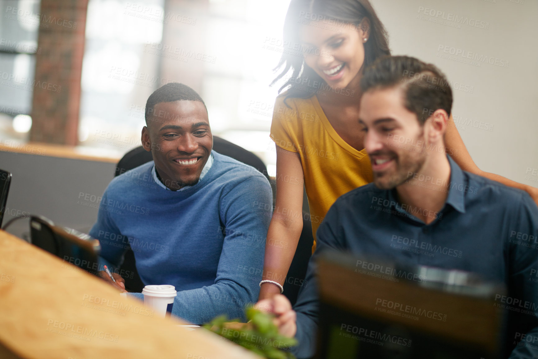 Buy stock photo Cropped shot of three businesspeople working in the office