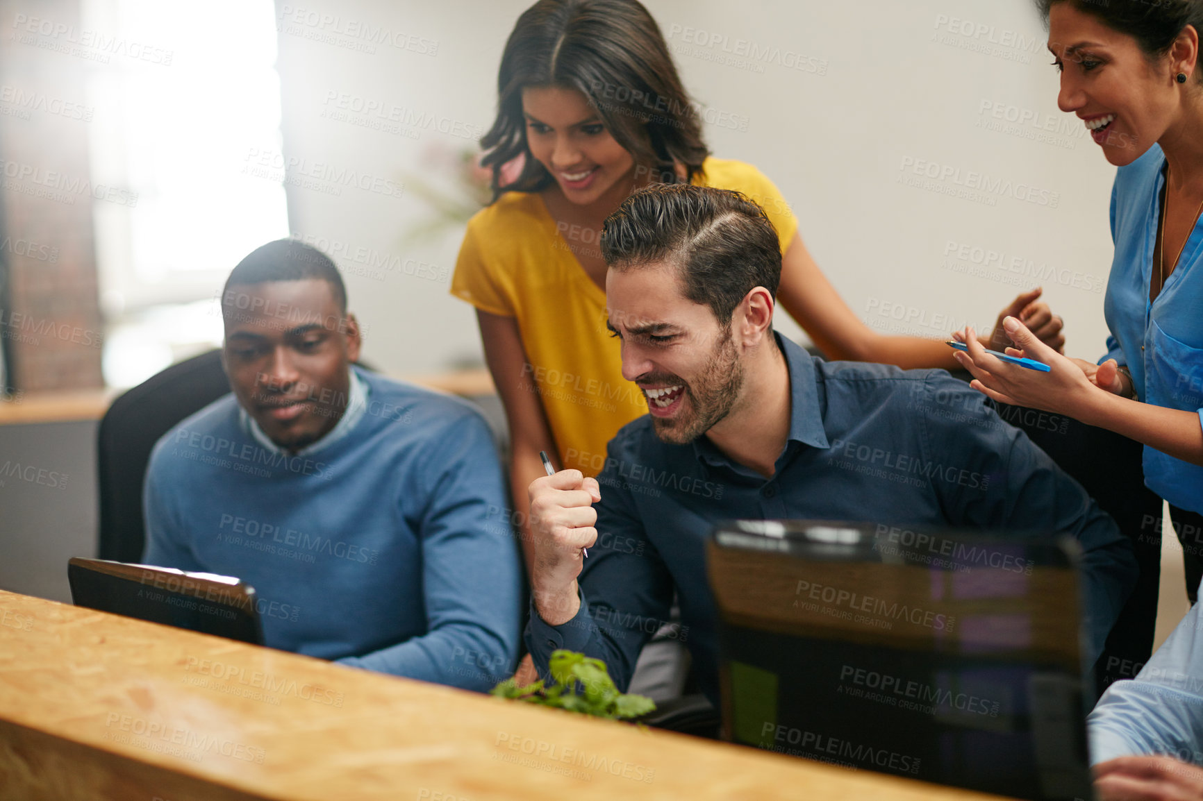 Buy stock photo Cropped shot of a group of creative professionals cheering in the office