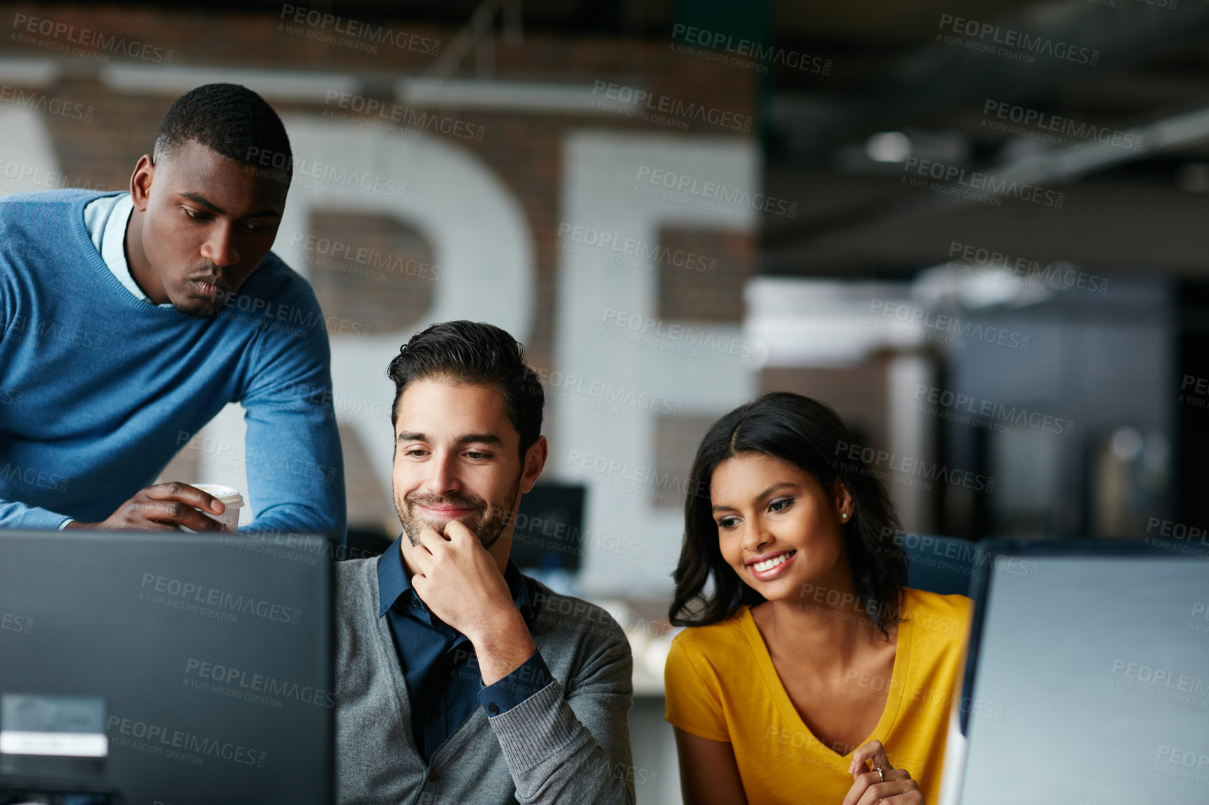 Buy stock photo Cropped shot of three businesspeople working in the office