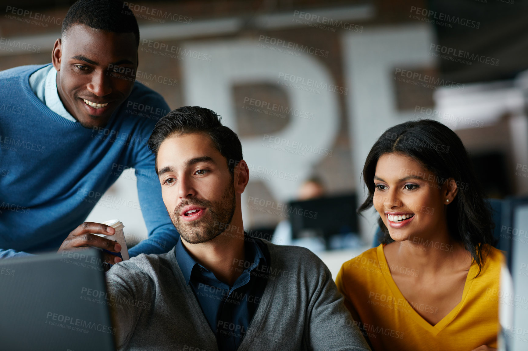 Buy stock photo Cropped shot of three businesspeople working in the office