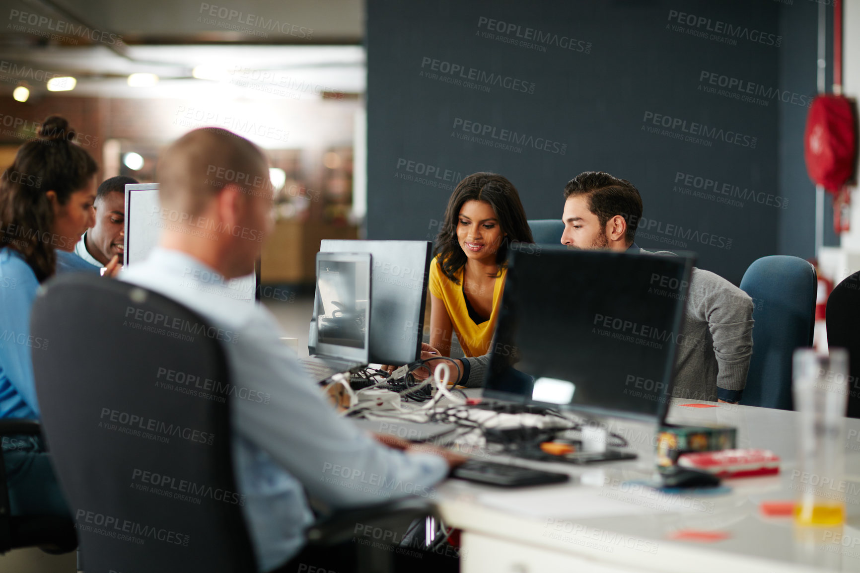 Buy stock photo Cropped shot of a group of businesspeople working in the office