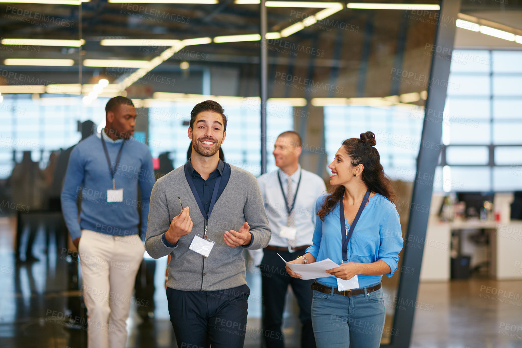 Buy stock photo Cropped shot of a group of businesspeople walking into work