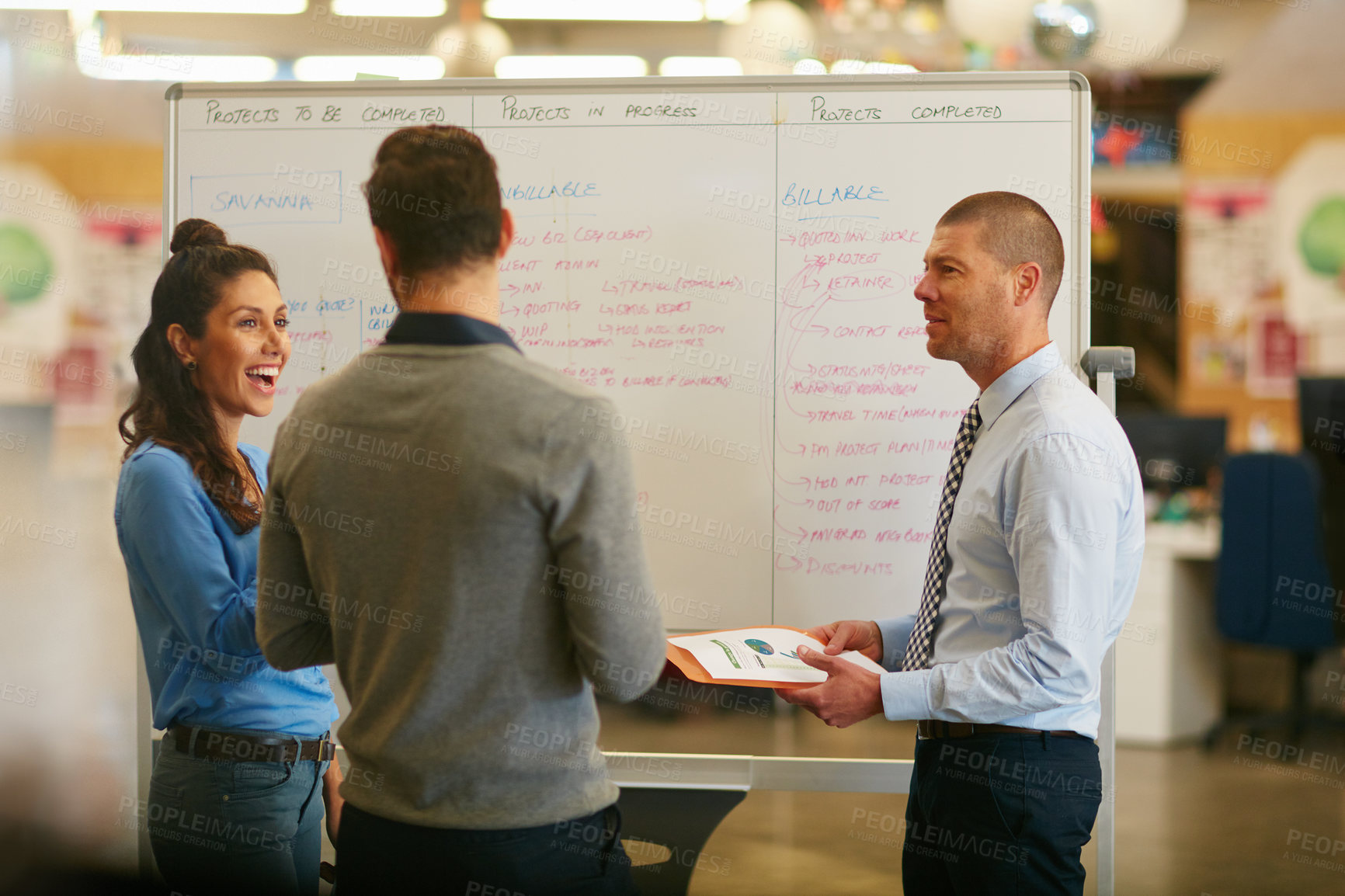 Buy stock photo Cropped shot of three businesspeople talking in the boardroom