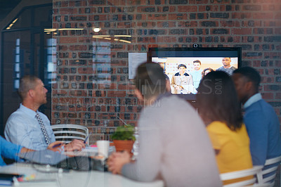Buy stock photo Cropped shot of a group of businesspeople in a video conference in the boardroom