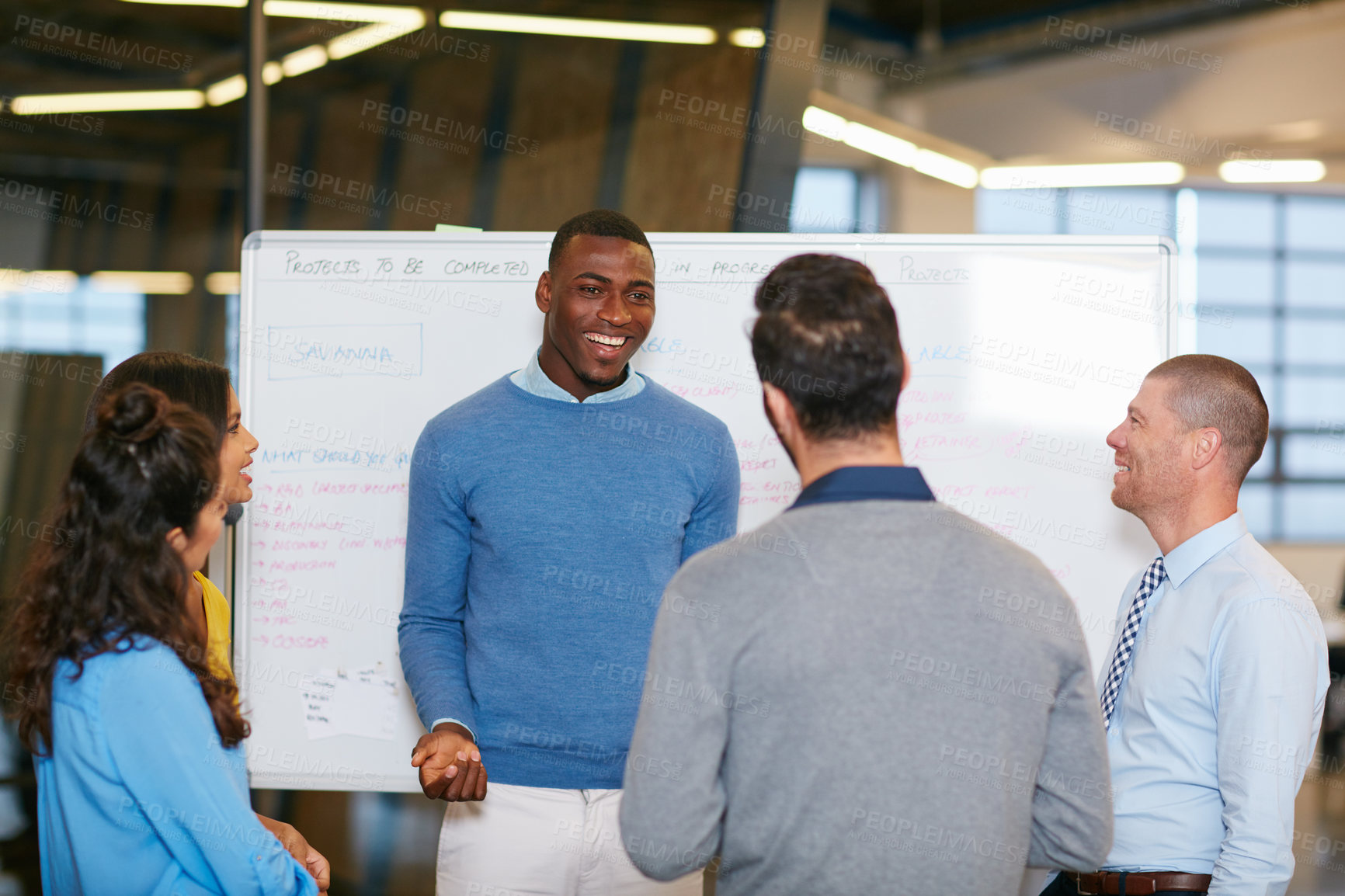 Buy stock photo Cropped shot of a group of businesspeople talking in the boardroom