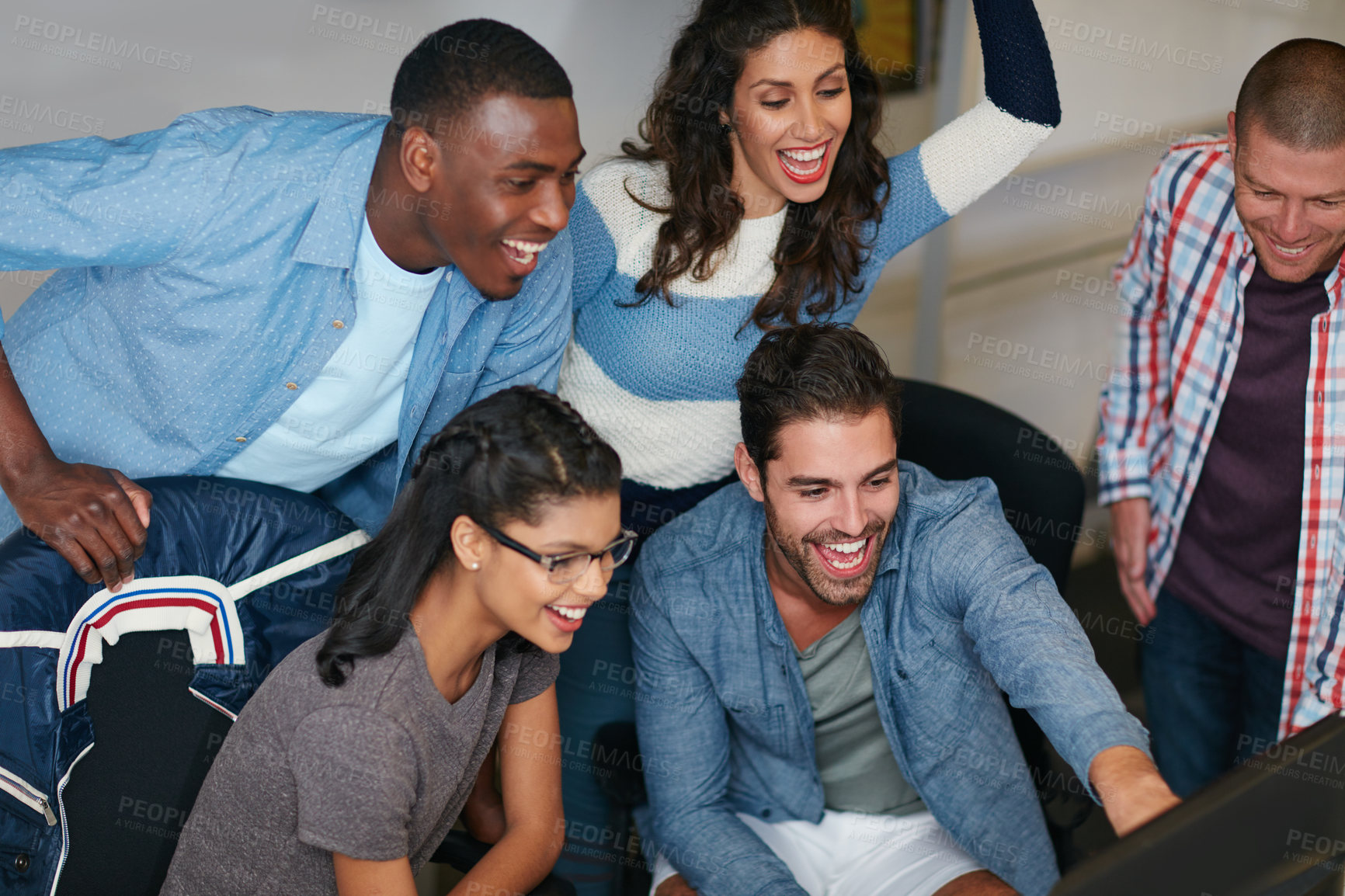 Buy stock photo Shot of team of colleagues using a computer together in a modern office