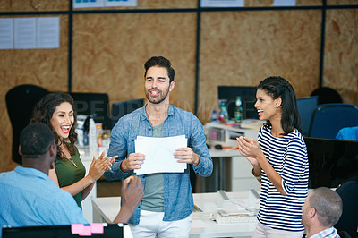 Buy stock photo Shot of a team of colleagues having an informal meeting in a modern office