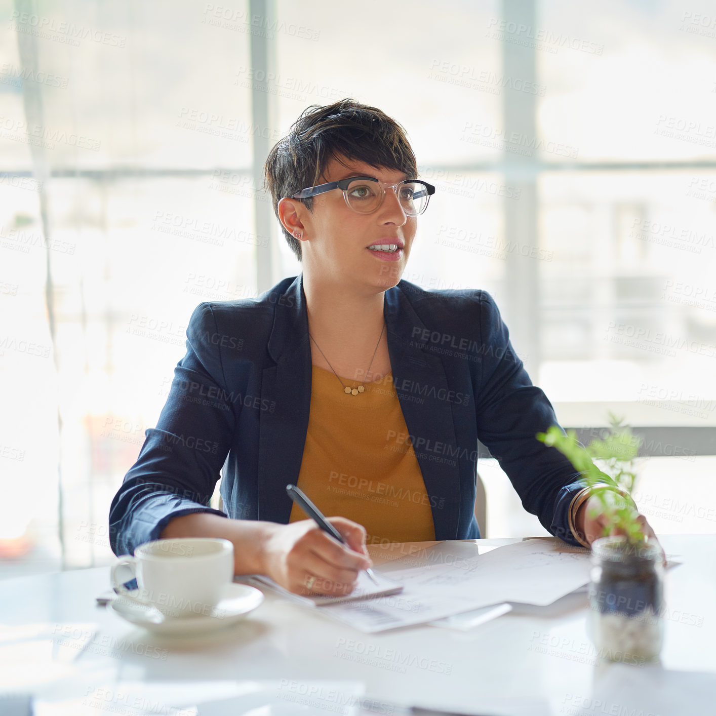 Buy stock photo Shot of a corporate businesswoman sitting in the boardroom