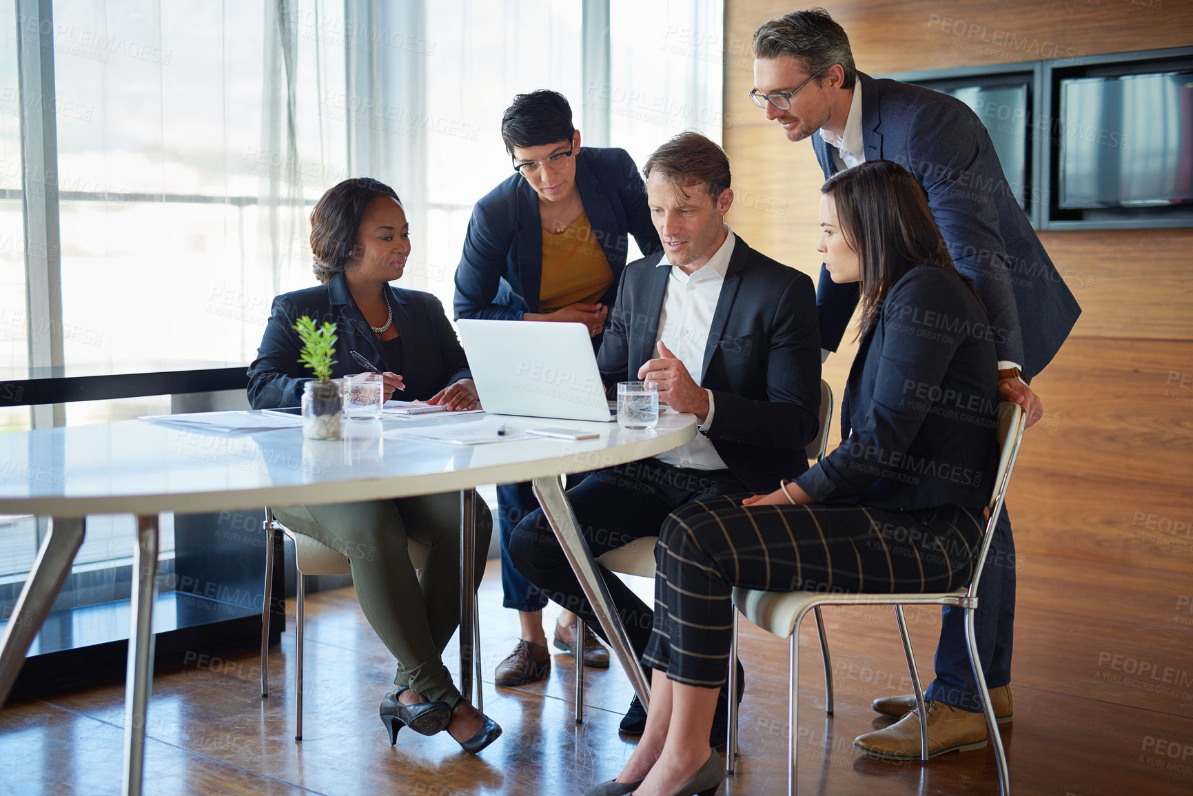 Buy stock photo Discussion, brainstorming and business people in the office with laptop for corporate planning. Teamwork, meeting and group of professional employees working on project in collaboration in workplace.