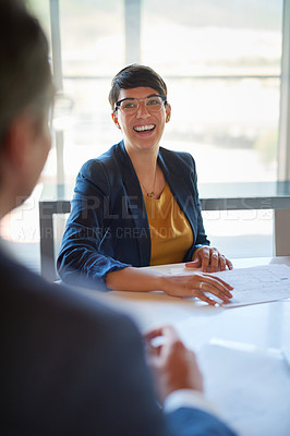 Buy stock photo Shot of two corporate businesspeople working in the boardroom