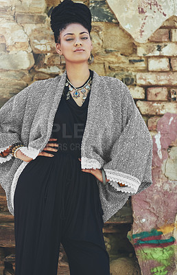 Buy stock photo Portrait of a fashionable young woman posing against a wall