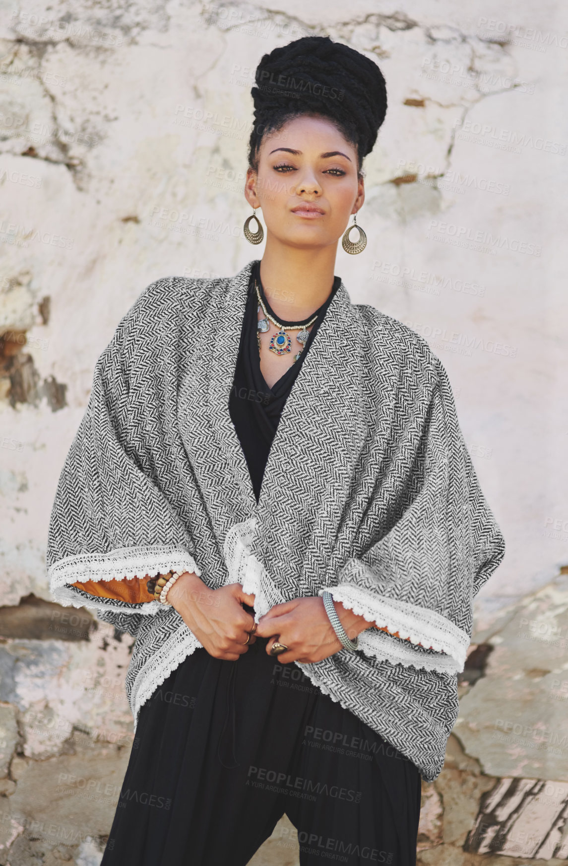 Buy stock photo Portrait of a fashionable young woman posing against a wall