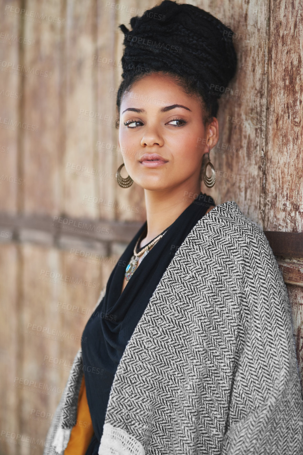 Buy stock photo Cropped shot of an attractive young woman posing outdoors