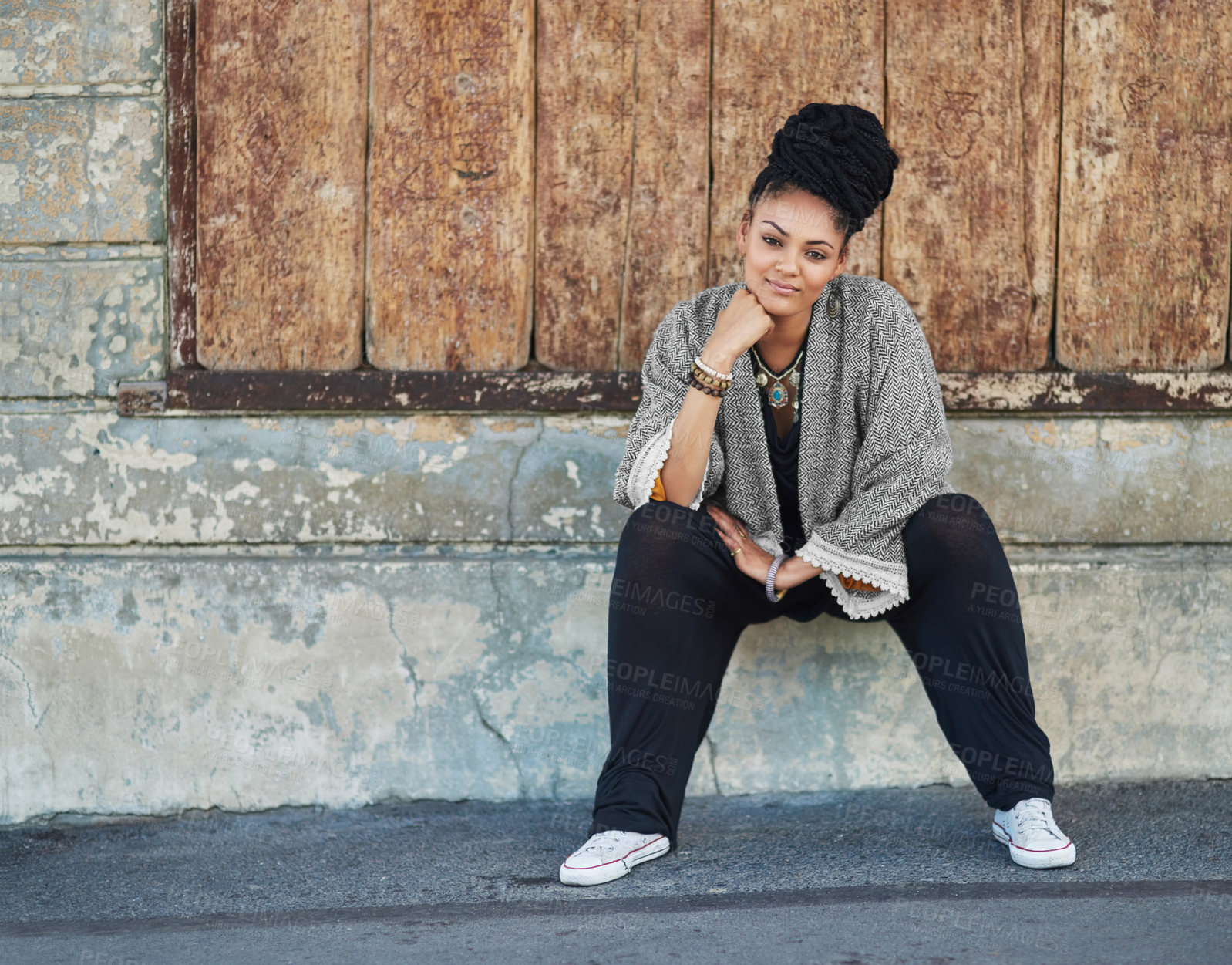 Buy stock photo Full length shot of a fashionable young woman sitting outside