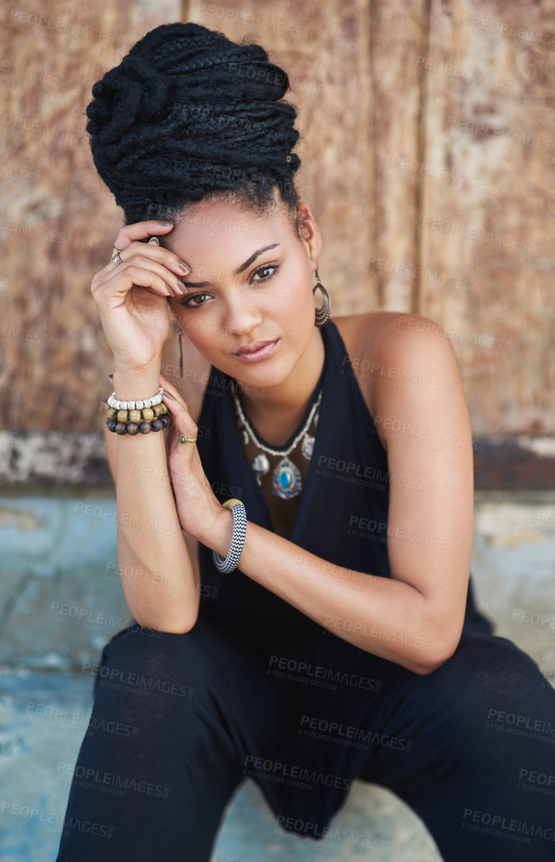 Buy stock photo Portrait, city or African woman with fashion, dreadlocks or bangles by wall in urban town to relax. Stylist, hairdresser and proud natural model with confidence or necklace for culture in Jamaica