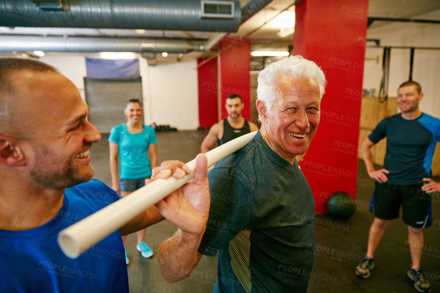 Buy stock photo Shot of a senior man doing pvc pipe exercises with the assistance of his trainer