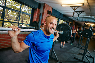 Buy stock photo Shot of a man doing weight training at the gym