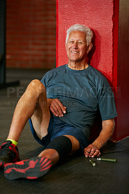 Buy stock photo Portrait of a happy senior man taking a break from his workout