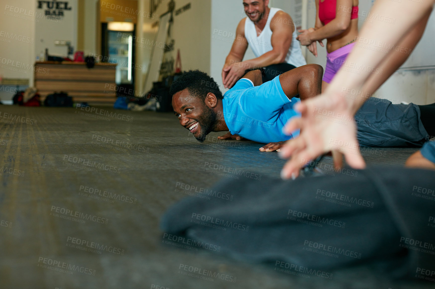 Buy stock photo Shot of a group of people working out in the gym