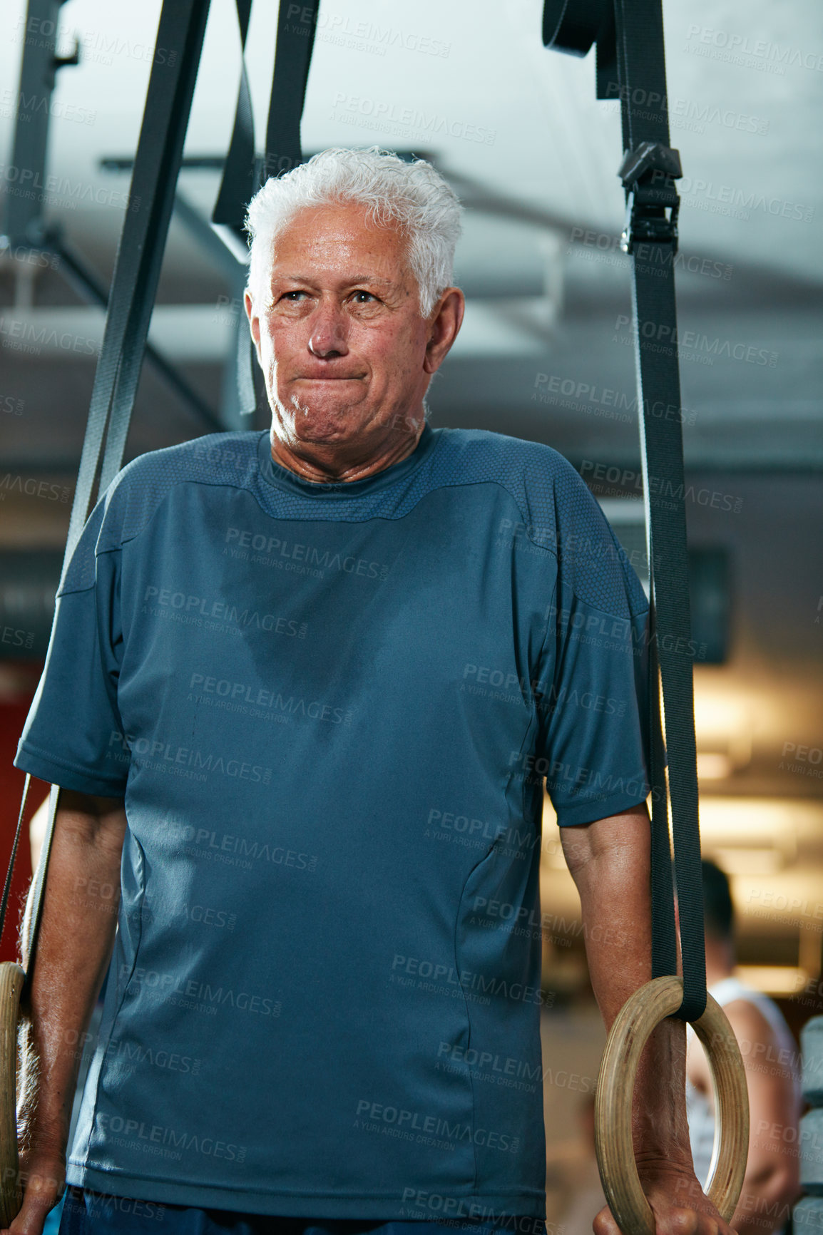 Buy stock photo Cropped shot of a senior man working out in the gym