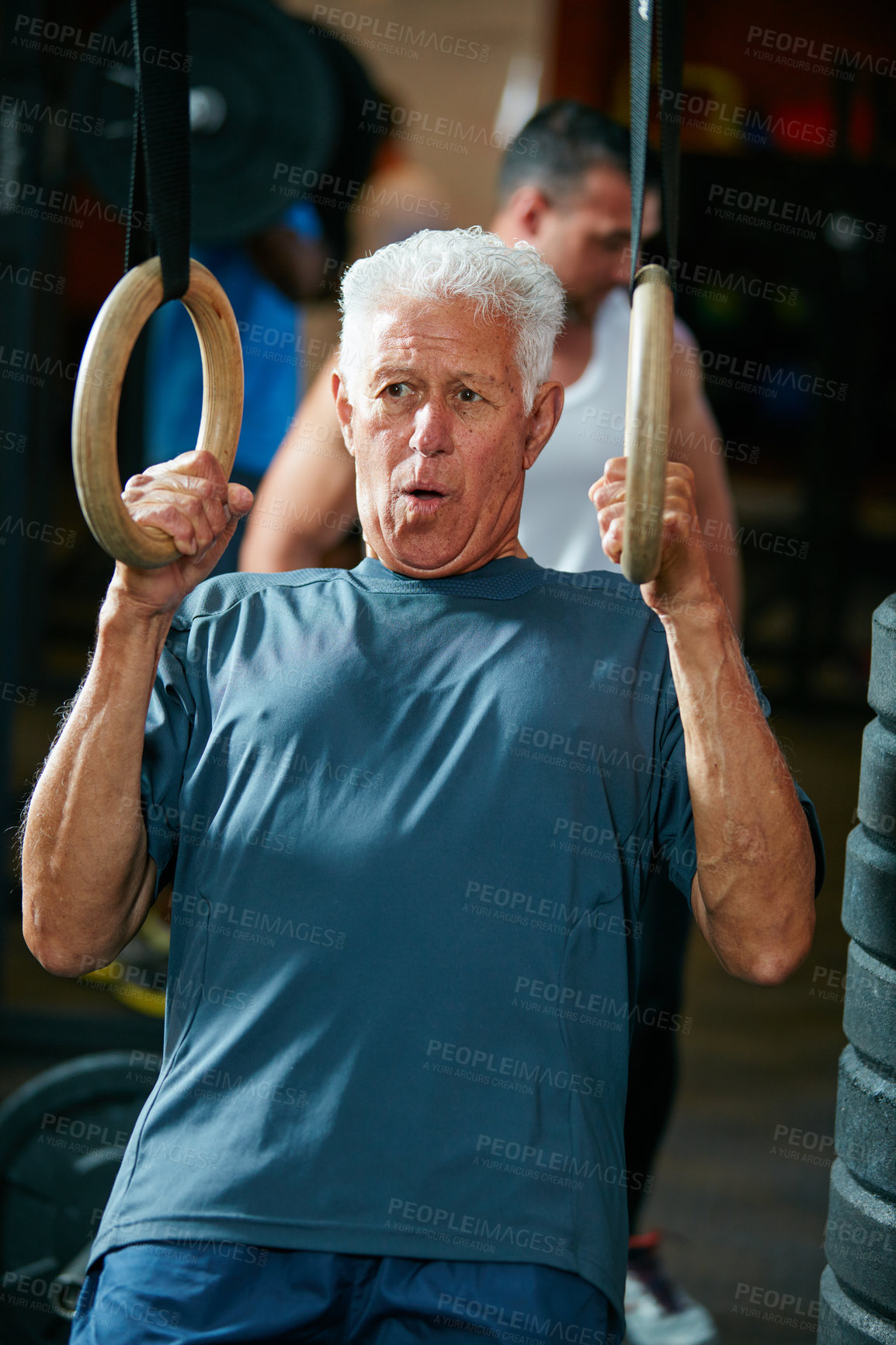 Buy stock photo Cropped shot of a senior man working out in the gym