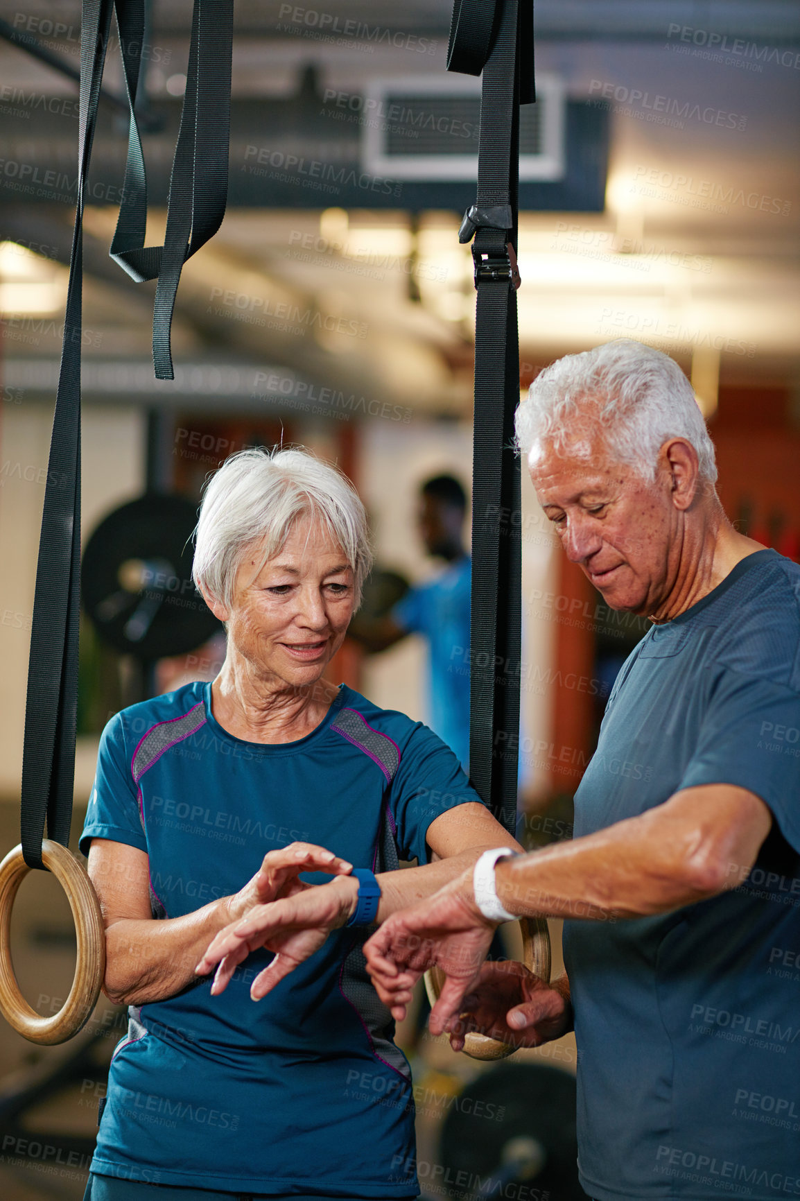 Buy stock photo Cropped shot of a senior couple working out in the gym