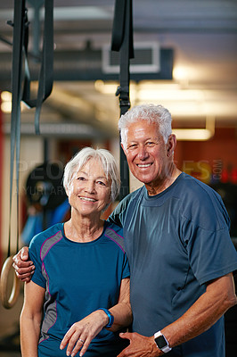 Buy stock photo Cropped portrait of a senior couple working out in the gym