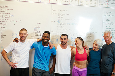 Buy stock photo Cropped portrait of a group of people standing with their arms around one another in the gym