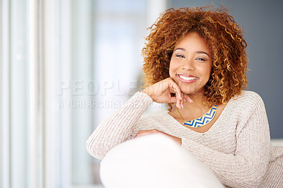 Buy stock photo Portrait of a young woman relaxing at home on the weekend