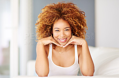 Buy stock photo Portrait of a young woman relaxing at home on the weekend