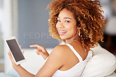 Buy stock photo Shot of a young woman relaxing at home on the weekend