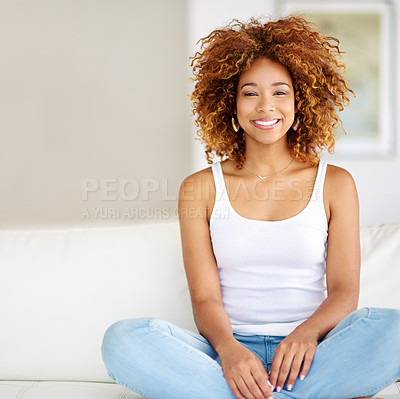 Buy stock photo Shot of a young woman relaxing at home on the weekend