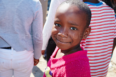 Buy stock photo Cropped portrait of a young child at a community outreach event