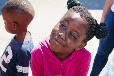 Buy stock photo Cropped portrait of a young child at a community outreach event