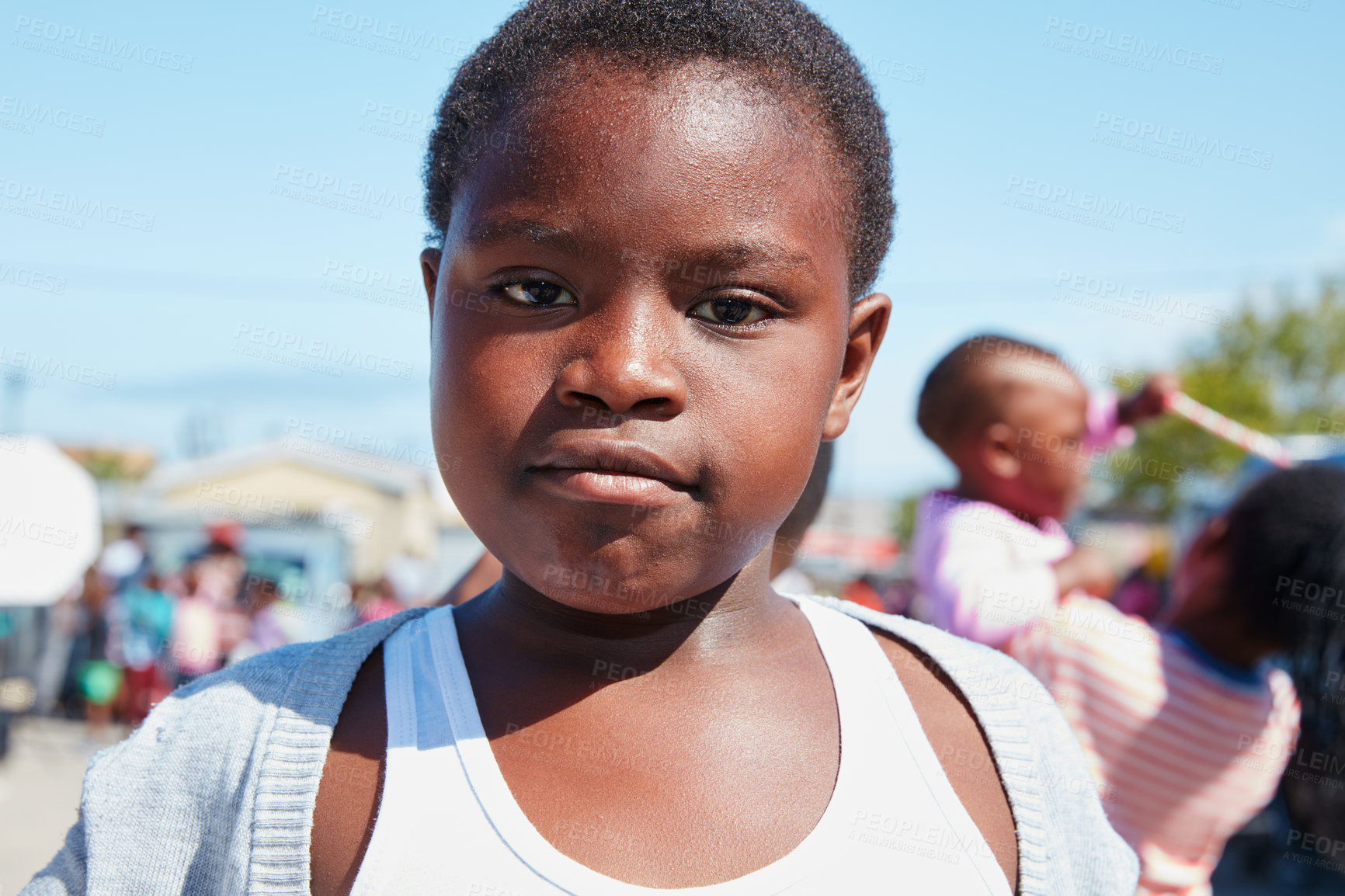 Buy stock photo Cropped portrait of a young child at a community outreach event