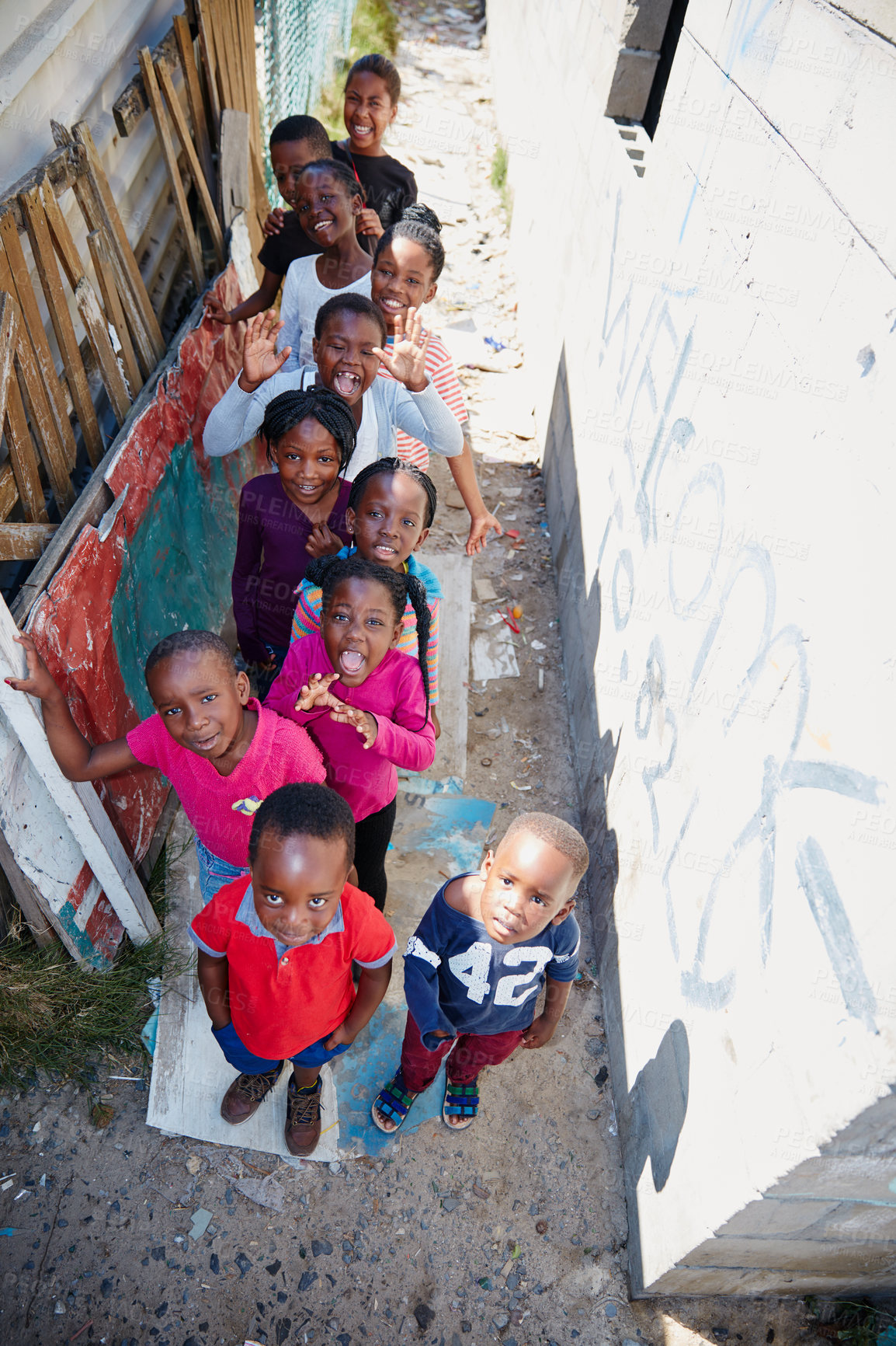 Buy stock photo Portrait, above and outreach with black children outdoor for youth drive, community service and welfare project. Rural charity program, poverty and social responsibility with group of kids in Africa