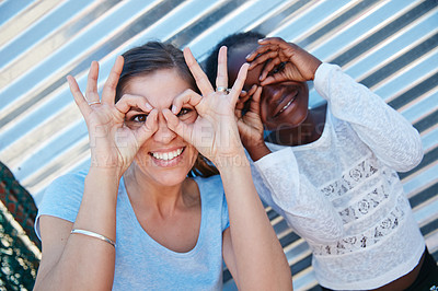 Buy stock photo Cropped portrait of a volunteer worker and a young child at a community outreach event