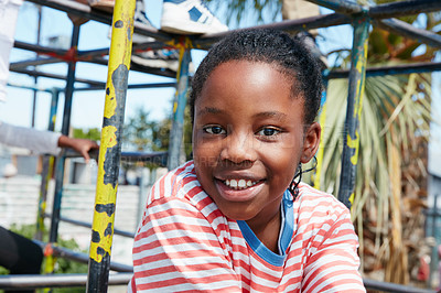 Buy stock photo Portrait of a happy little girl playing on a jungle gym