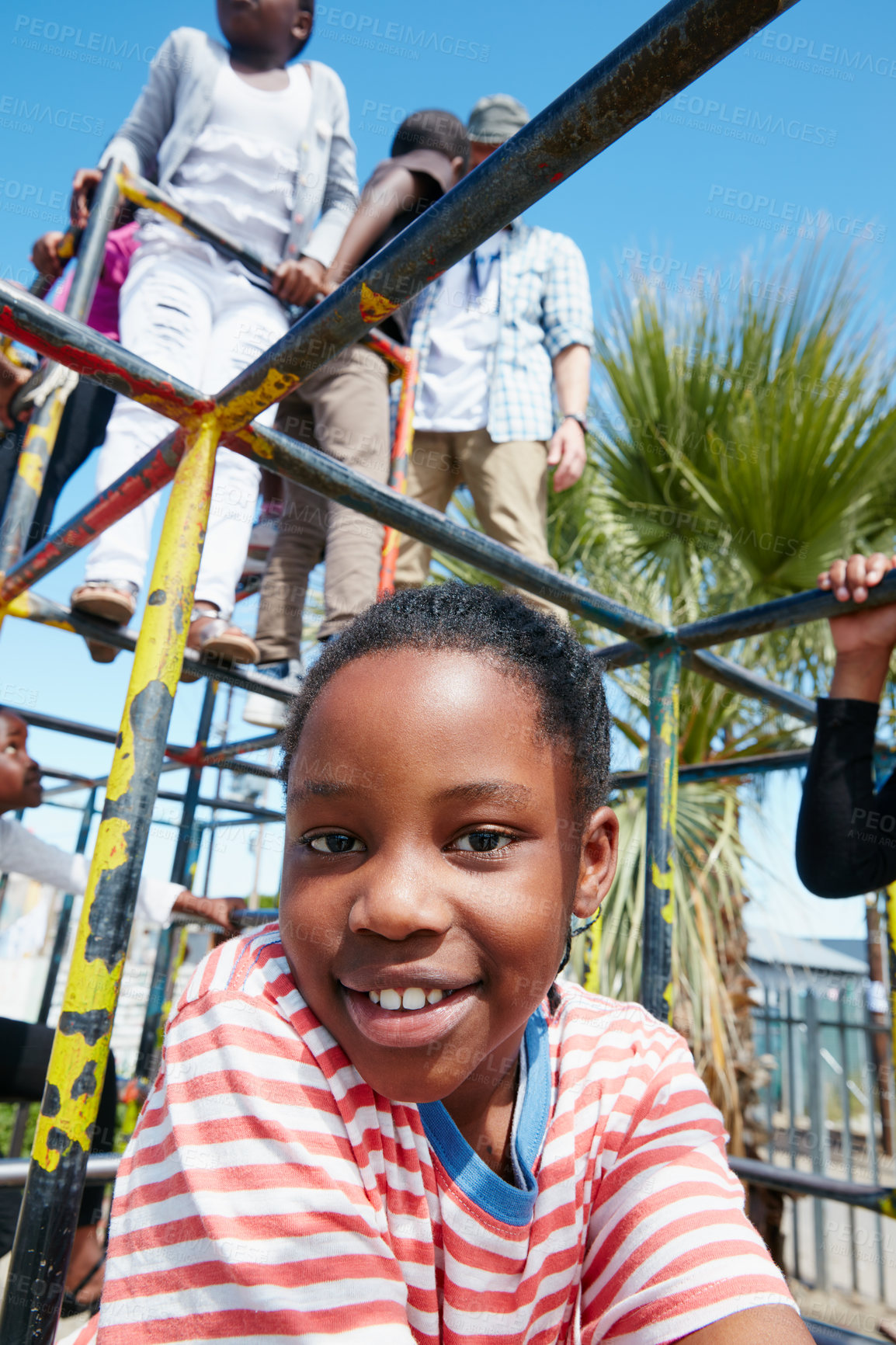 Buy stock photo Portrait of a happy little girl playing on a jungle gym