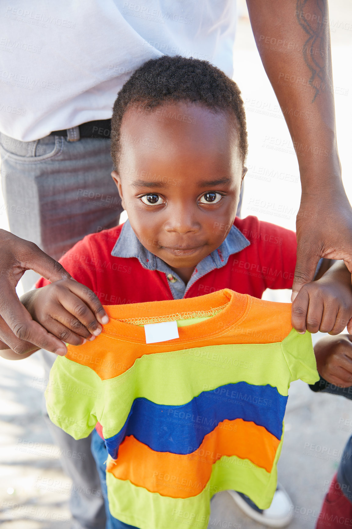 Buy stock photo Cropped shot of underprivileged kids receiving clothing