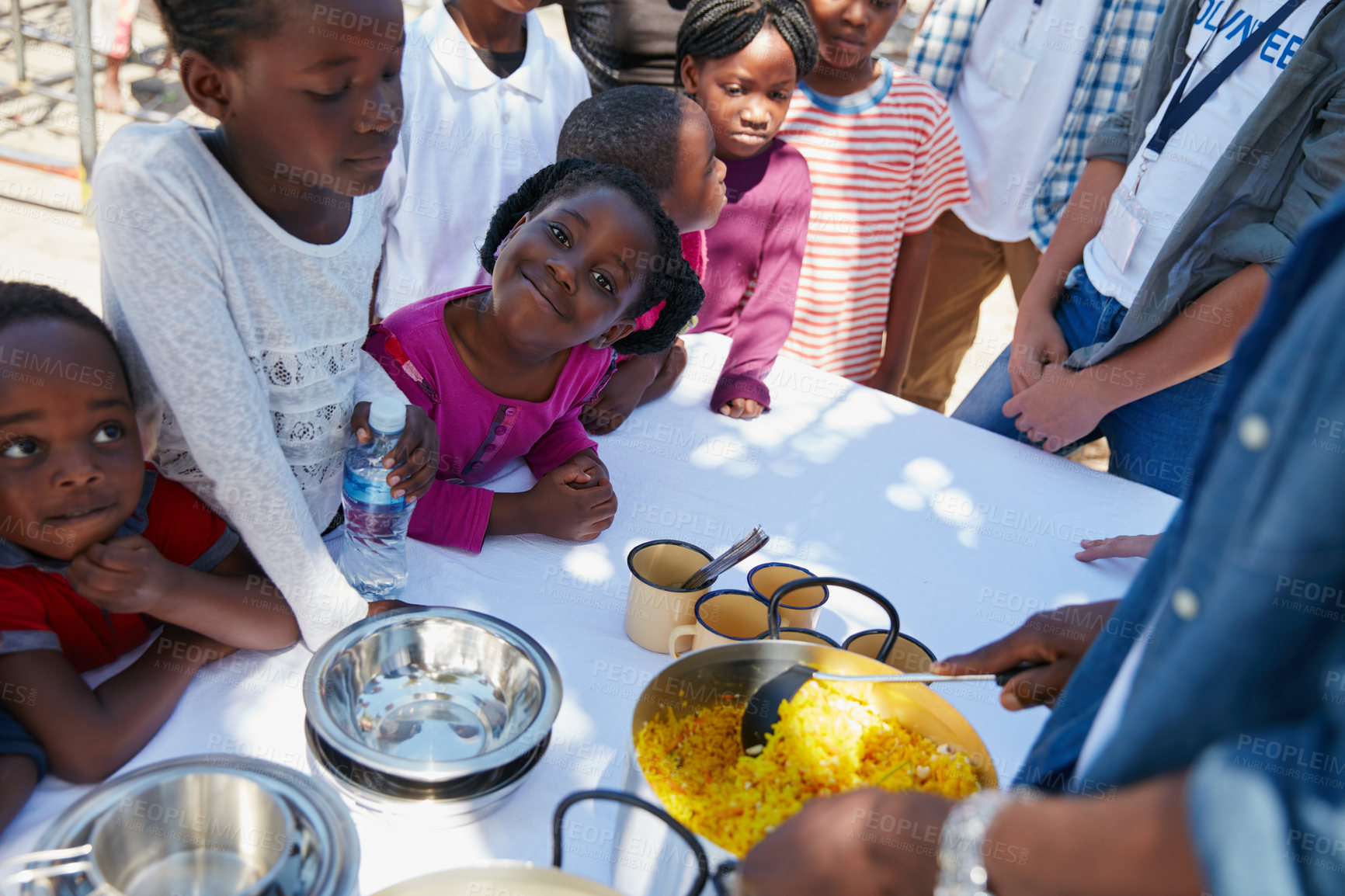 Buy stock photo Cropped portrait of children getting fed at a food outreach