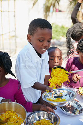 Buy stock photo Cropped shot of children getting fed at a food outreach