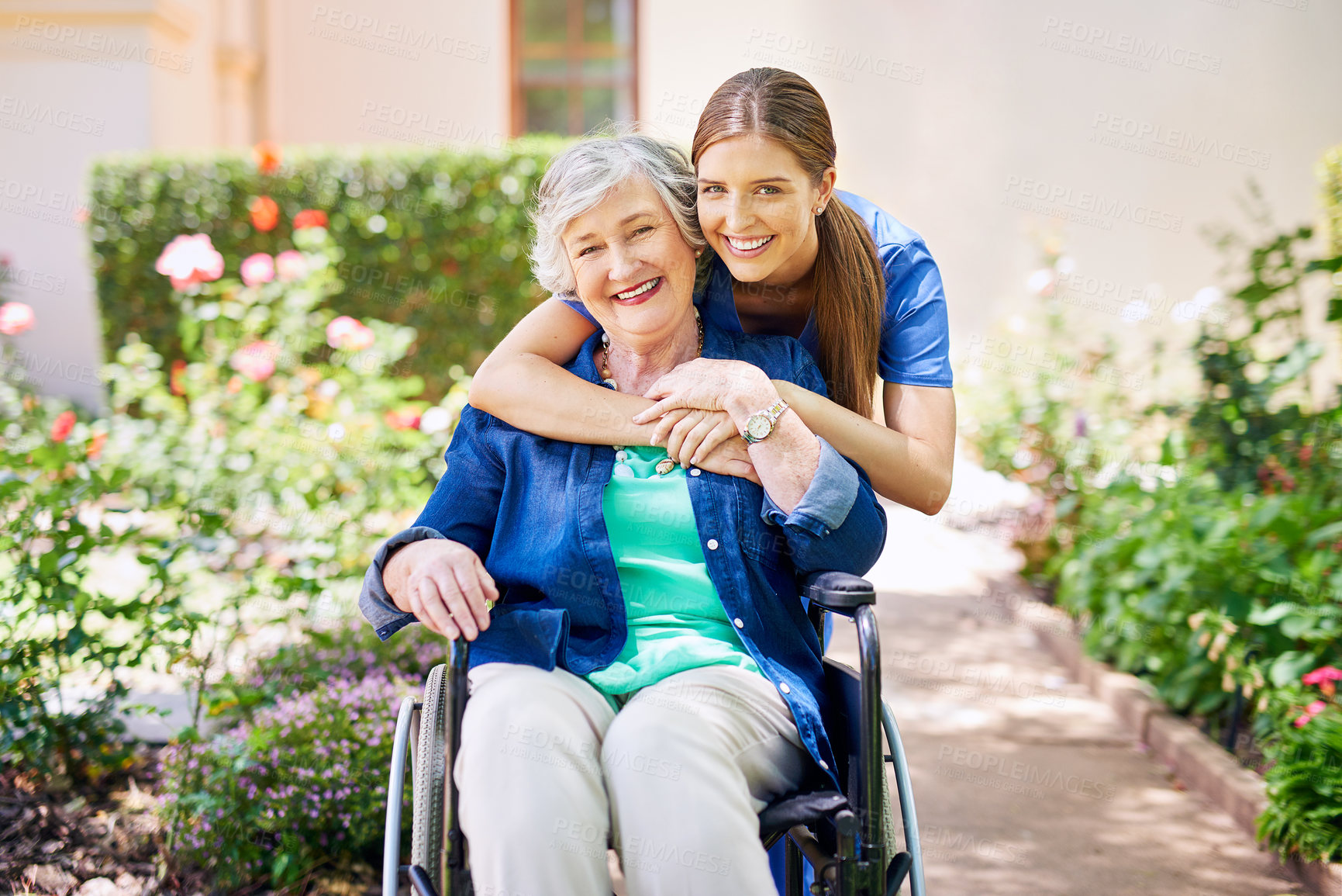 Buy stock photo Shot of a resident and a nurse outside in the retirement home garden