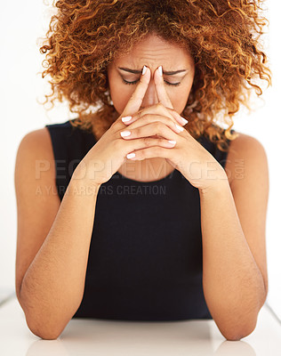 Buy stock photo Shot of a young businesswoman experiencing stress at work
