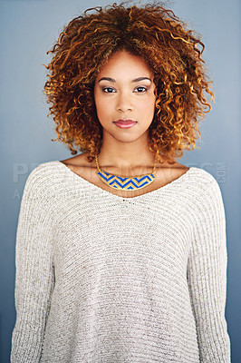 Buy stock photo Portrait of a young woman standing against a grey background