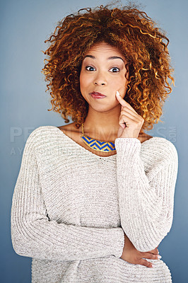 Buy stock photo Studio shot of a young woman against a grey background