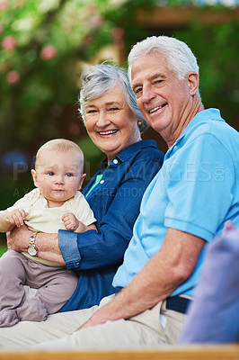 Buy stock photo Cropped shot of a senior couple spending time with their grandson